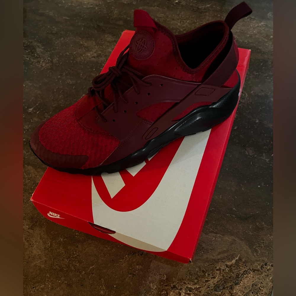 Size 12 Nike Huraches Run Ultra . New never worn. Darker red